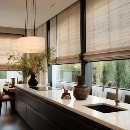 Woven blinds fitted across a kitchen window above a stone counter and sink.