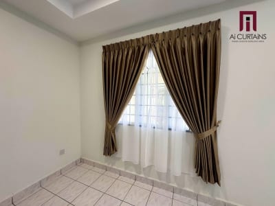 A plain white room with the same brown drape and sheer pairing at a single window.